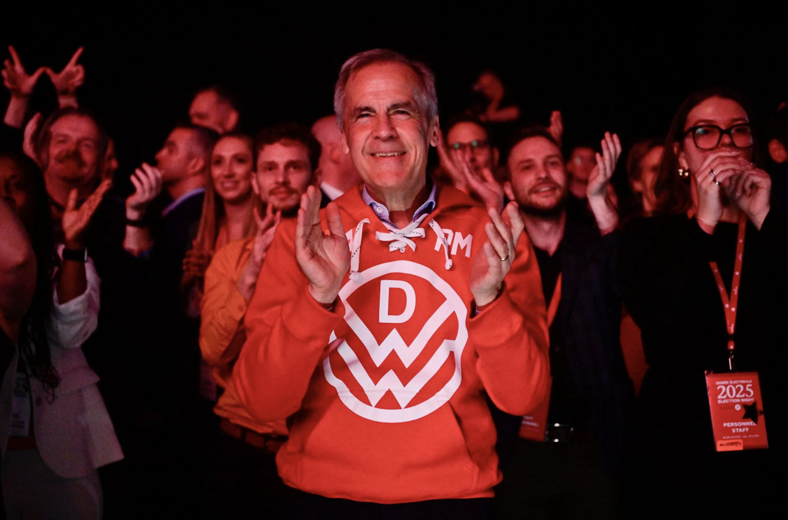 Mark Carney in a Down With Webster hoodie